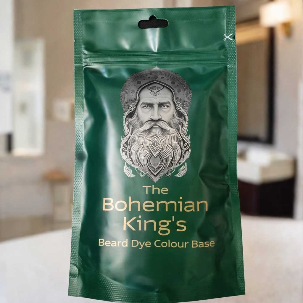 Green packaging of 'The Bohemian King's' beard dye with a man's face on it, set against a blurred bathroom background.