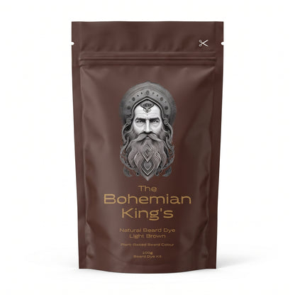 A stand-up pouch of 'The Bohemian King's' Natural Beard Dye in Light Brown, featuring a metallic silver illustration of a bearded king's face on a dark brown background.